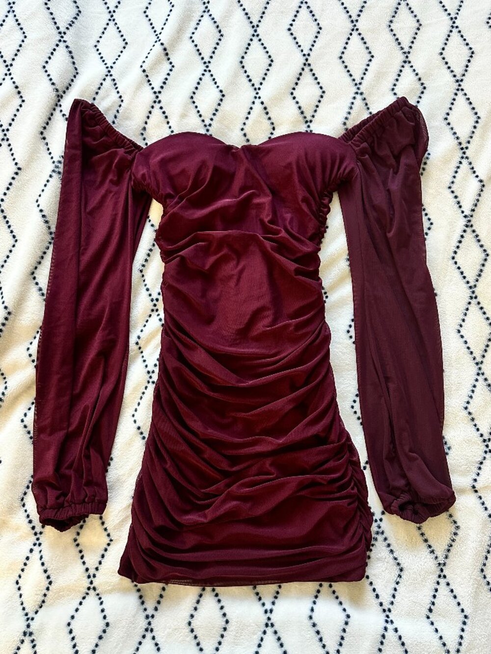 burgundy velvet bodycon mini dress with ruched details and long sleeves